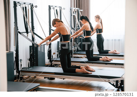 Exercises for the spine. Women in fitness center 128570131