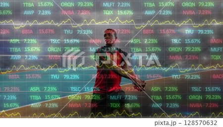 Image of data processing over male volleyball player in action at sports stadium 128570632