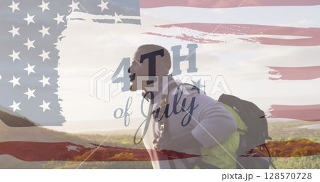 Image of independence day text over african american man hiking 128570728