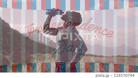 Image of independence day text over african american man drinking water in mountains 128570744