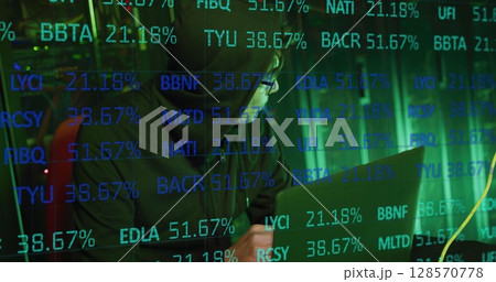 Image of data processing over asian male hacker with laptop by computer servers 128570778