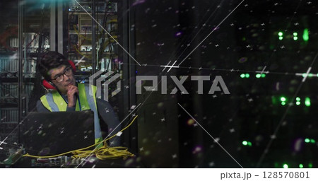 Image of statistics processing over asian male it engineer with laptop by computer server 128570801