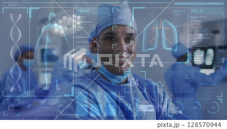 Image of medical data processing over smiling male surgeon in operating theatre 128570944