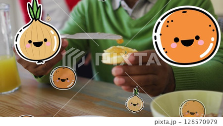 Image of smiling vegetables and fruits over happy african american senior man eating at home Image of smiling vegetables and fruits over happy african american senior man eating at home 128570979