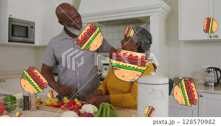 Image of hamburgers over happy african american senior couple preparing food at home Image of hamburgers over happy african american senior couple preparing food at home 128570982