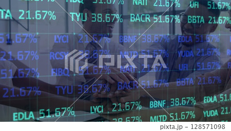 Image of financial data processing over happy business people stacking hands in meeting Image of financial data processing over happy business people stacking hands in meeting 128571098