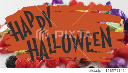 Happy halloween text banner with flying bats icons against scary eye toy and halloween candies 128571141