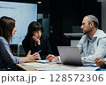 Business executives discussing startup investment losses in boardroom meeting 128572306
