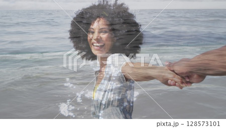 Image of happy african american couple walking at beach over sea Image of happy african american couple walking at beach over sea 128573101