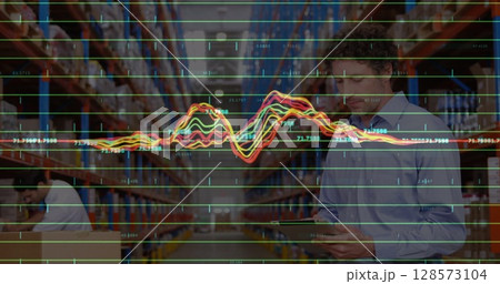 Image of financial data processing over diverse business people in warehouse Image of financial data processing over diverse business people in warehouse 128573104