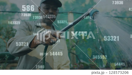 Image of numbers over african american worker watering plants 128573206