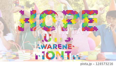 Image of autism awareness month text over diverse children at party 128573216