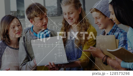 Image of mathematical equations over school children using laptop in classroom Image of mathematical equations over school children using laptop in classroom 128573298