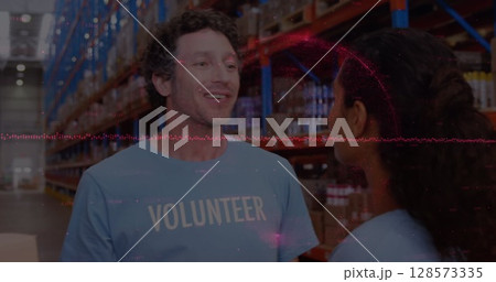 Image of financial data processing over diverse volunteers in warehouse 128573335
