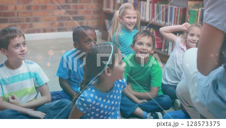 Image of falling network of connections over diverse students in class at school 128573375