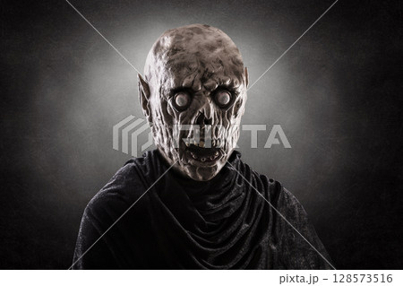 Portrait of a zombie over dark misty background 128573516