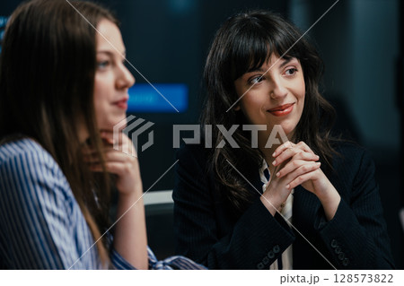 Senior female partner mentoring junior manager celebrating success and workplace solidarity Senior female partner mentoring junior manager celebrating success and workplace solidarity 128573822