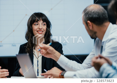 Happy female executive celebrating successful client deal and financial achievement closeup Happy female executive celebrating successful client deal and financial achievement closeup 128573823