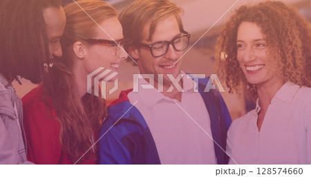 Image of diverse group of friends smiling and using tablet Image of diverse group of friends smiling and using tablet 128574660