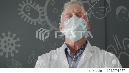 Image of medical icons over caucasian male doctor wearing face mask 128574672