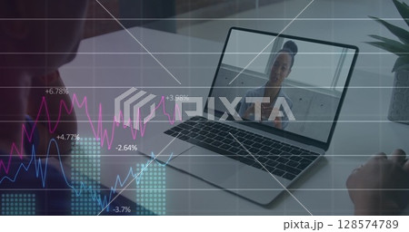 Image of statistics and data processing over biracial businesswoman on laptop image call 128574789