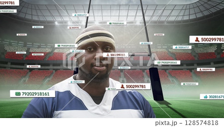 Image of media icons over african american male rugby player with ball at stadium 128574818