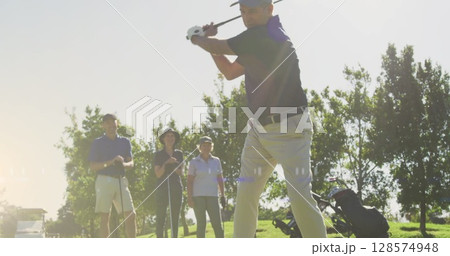 Image of light trails over senior caucasian couple playing golf on golf course Image of light trails over senior caucasian couple playing golf on golf course 128574948