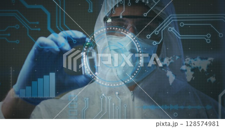 Image of medical data processing over caucasian man in face mask and ppe suit holding vaccine 128574981