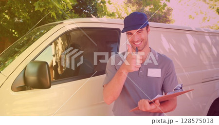 Image of smiling caucasian male deliverer taking notes on clipboard Image of smiling caucasian male deliverer taking notes on clipboard 128575018