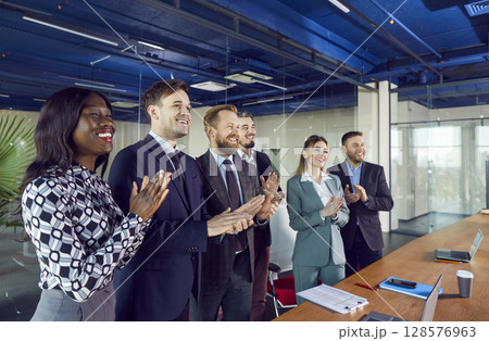 Happy friendly diverse employees applauding congratulating with business achievement, great result 128576963