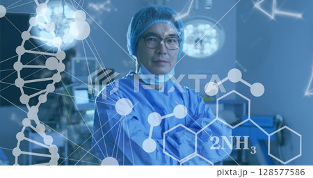 Image of medical data processing over asian male doctor with face mask 128577586
