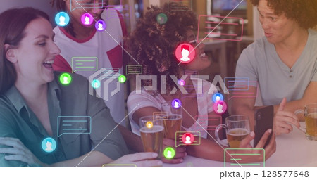 Image of media icons over happy diverse friends drinking beer 128577648