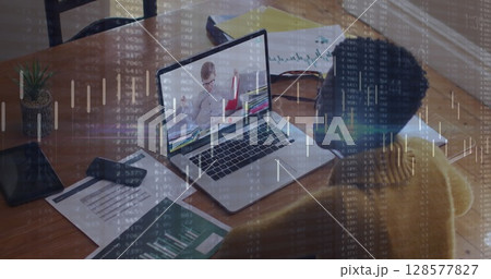 Image of financial data processing over african american businesswoman using laptop 128577827