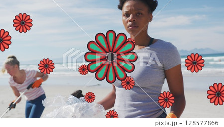 Image of flowers over african american female volunteer picking up rubbish on beach Image of flowers over african american female volunteer picking up rubbish on beach 128577866