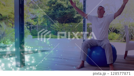 Image of light spots over senior caucasian man practicing yoga and meditating 128577871