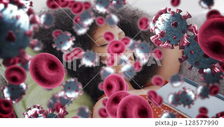 Image of virus cells over african american woman relaxing Image of virus cells over african american woman relaxing 128577990