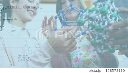 Image of mathematical equations and math text over caucasian schoolchildren with models 128578110