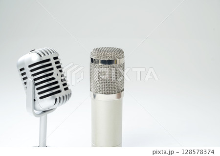 Studio and vintage silver microphone for podcasting or streaming with a white background 128578374