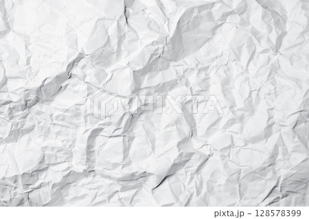 White crumpled paper texture abstract background. Creased and wrinkled paper surface. Copy space White crumpled paper texture abstract background. Creased and wrinkled paper surface. Copy space 128578399