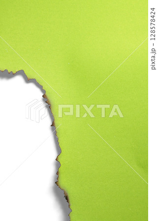Green paper ripped message torn with burnt edges isolated on a white background. Copy space Green paper ripped message torn with burnt edges isolated on a white background. Copy space 128578424