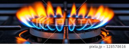 Close-Up of Lively Blue Flames on a Gas Stove 128578616
