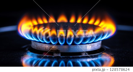 Close-Up of Lively Blue Flames on a Gas Stove 128578624