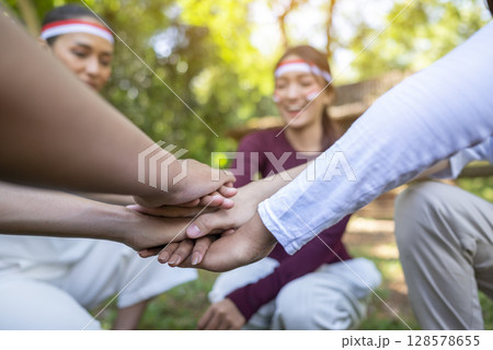 Portrait of an Indonesian southeast asian people celebrate Indonesia Independence Day on the 17th of August. Concept of Kemerdekaan Indonesia 128578655