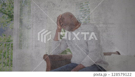 Image of moving background over sad senior african american man Image of moving background over sad senior african american man 128579122