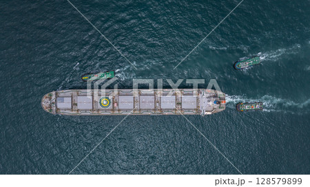 Aerial view bulk carrier cargo ship vessel global business logistic import export industry, Bulk carrier cargo ship vessel dry general cargo vessel underway on sea to port. Aerial view bulk carrier cargo ship vessel global business logistic import export industry, Bulk carrier cargo ship vessel dry general cargo vessel underway on sea to port. 128579899