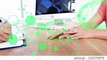 Image of scientific data processing over hands of caucasian female doctor and patient 128579978