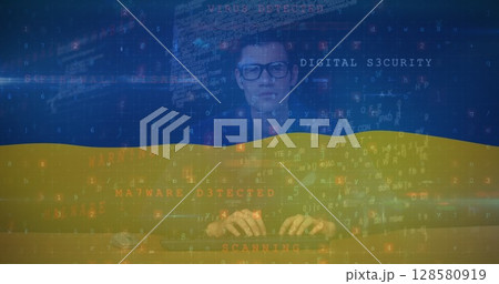Image of caucasian male hacker and data processing over flag of ukraine Image of caucasian male hacker and data processing over flag of ukraine 128580919