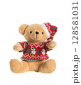 Cute plush teddy bear wearing a red Christmas sweater and Santa hat, sitting on white background  128581031