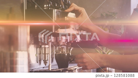 Image of glowing moving lights over coffee machine Image of glowing moving lights over coffee machine 128581088