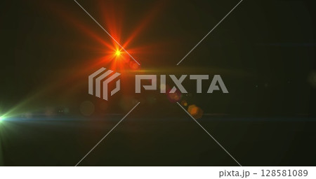 Image of glowing spots of lights over dark background Image of glowing spots of lights over dark background 128581089